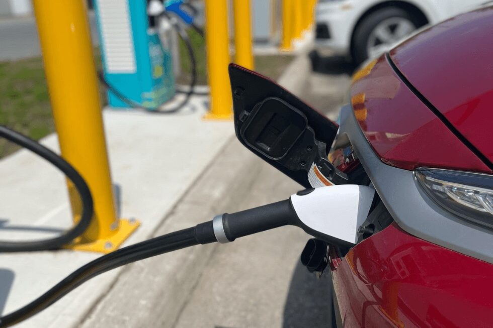 Charging port plugged into electric vehicle and charging.